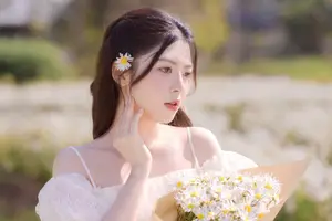 Ethereal Beauty: Young Woman in White Dress with Bouquet Amidst Dreamy Clouds - image 5