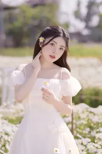 Ethereal Beauty: Young Woman in White Dress with Bouquet Amidst Dreamy Clouds - image 1