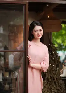 Discover Serene Vietnamese Beauty: Elegant Woman in Pink Linen Dress Amidst Floral Charm - image 4