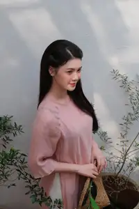Discover Serene Vietnamese Beauty: Elegant Woman in Pink Linen Dress Amidst Floral Charm - image 7