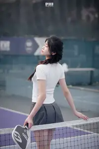 Pensive Break on Court: Young Tennis Player Recharges Energy After Intense Training Session - image 4