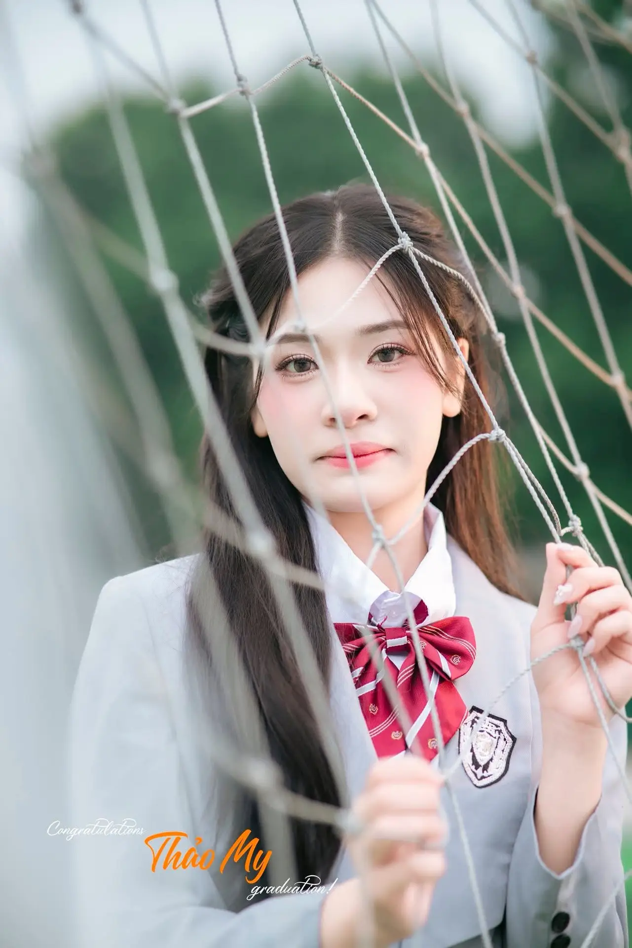 Cute Schoolgirl Frames a Moment on Green Grass