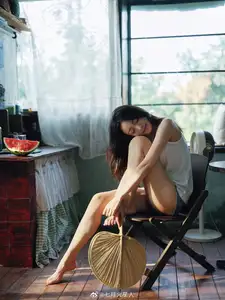 Gentle Moments: A Young Woman's Natural Beauty by the Sunlit Window - image 0