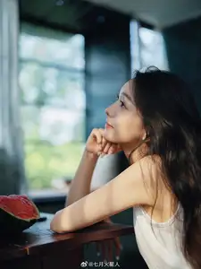 Gentle Moments: A Young Woman's Natural Beauty by the Sunlit Window - image 2