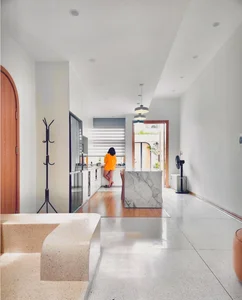 Innovative Townhouse Design: Swapping the Living Room with a Central Kitchen Island - image 1