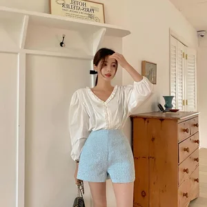 4 Essential White Tops Every Woman Needs for a Chic Spring and Summer Wardrobe - image 3