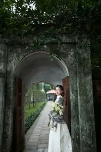 Graceful East Asian Beauty: Woman in Traditional Attire, Elegant with a Paper Fan. - image 2