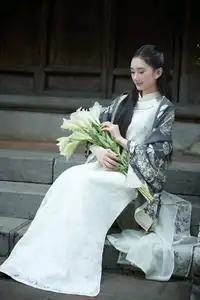 Graceful East Asian Beauty: Woman in Traditional Attire, Elegant with a Paper Fan. - image 4