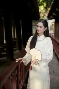 Graceful East Asian Beauty: Woman in Traditional Attire, Elegant with a Paper Fan. - image 3