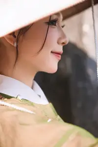 Timeless Vietnamese Charm: Elegant Girl in Traditional Attire and Nón Quai Thao - image 0