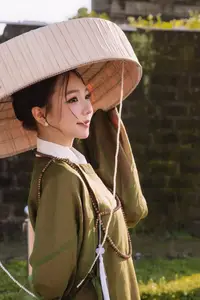 Timeless Vietnamese Charm: Elegant Girl in Traditional Attire and Nón Quai Thao - image 8