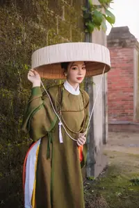 Timeless Vietnamese Charm: Elegant Girl in Traditional Attire and Nón Quai Thao - image 7