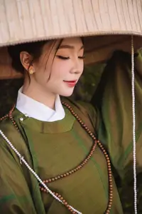 Timeless Vietnamese Charm: Elegant Girl in Traditional Attire and Nón Quai Thao - image 3