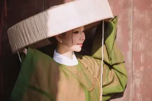 Timeless Vietnamese Charm: Elegant Girl in Traditional Attire and Nón Quai Thao - image 5