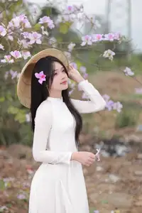 Elegant Vietnamese Student in Ao Dai Amidst Bauhinia Flowers - image 7