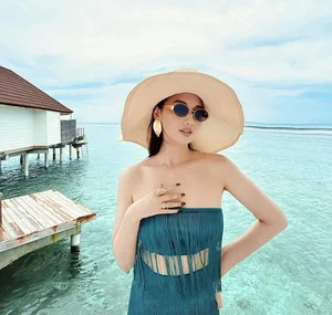 Lã Thanh Huyền Stunning Vacation Style: Exploring Elegant Sheer Dress Trends and Summer Travel Fashion Inspiration - image 0