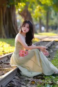 Elegant Young Woman's Gentle Beauty by Ancient Tracks: A Poetic Nature Portrait - image 4