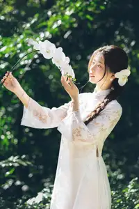 Charming Young Woman in White Lace & Orchids: Radiant Natural Beauty Amidst Greenery 1000026906 - image 2