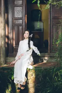 Charming Young Woman in White Lace & Orchids: Radiant Natural Beauty Amidst Greenery 1000026906 - image 0