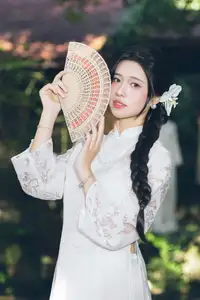 Charming Young Woman in White Lace & Orchids: Radiant Natural Beauty Amidst Greenery 1000026906 - image 1