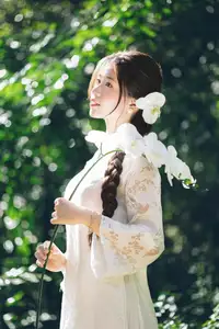Charming Young Woman in White Lace & Orchids: Radiant Natural Beauty Amidst Greenery 1000026906 - image 3