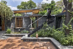 Eco-Friendly Basalt Stone House Hidden Within 5,000 Trees - image 11